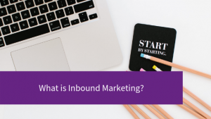 Blog title What is Inbound Marketing, words on purple strip over laptop and pencils