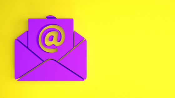 Purple email at icon in purple envelope on yellow background. Blog on email marketing during Covid times.